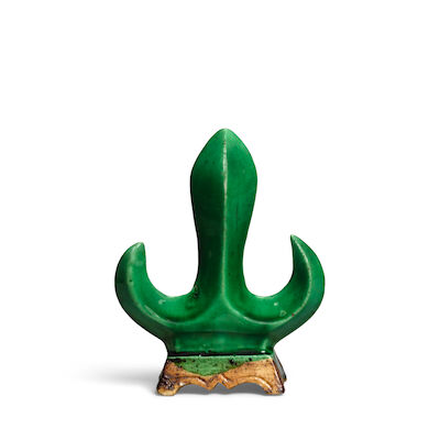 A GREEN-GLAZED TRISULA-SHAPED BRUSHREST Kangxi