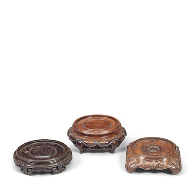 A GROUP OF THREE CARVED WOOD STANDS 19th/20th century (3)