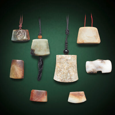 A GROUP OF EIGHT JADE SWORD CHAPES AND GUARDS Probably Han Dynasty and later (8)