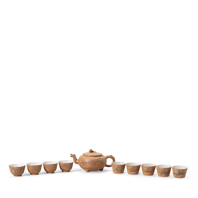 A YIXING TEAPOT AND COVER AND TWO SETS OF TEA CUPS Early 20th century, the cups dated wuwu year (1918) and of the period. (11)