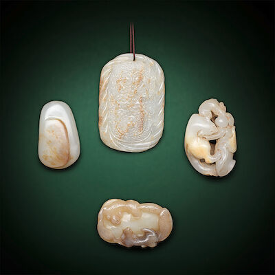 A JADE GROUP INCLUDING TWO SQUIRREL PENDANTS; AN INSCRIBED PEBBLE-SHAPED PENDANT; AND AN OVAL PENDANT Qing Dynasty and later (4)