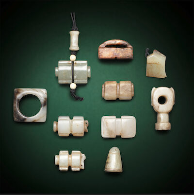 A GROUP OF TEN JADE CARVINGS AND FITTINGS Han to Ming Dynasty (10)