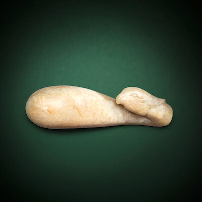 A PALE GREEN AND RUSSET JADE PHOENIX-HEAD BELT HOOK Ming Dynasty