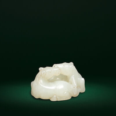 A VERY PALE GREEN JADE CARVING OF TWO HORSES 18th century