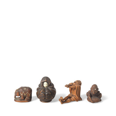 A COLLECTION OF FOUR WOOD NETSUKE 19th century (5)