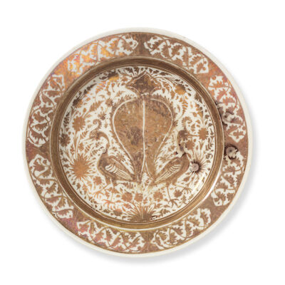 A Safavid lustre pottery dish with peacocks Persia, second half of the 17th Century