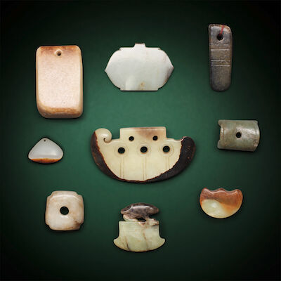A GROUP OF NINE JADE CARVINGS AND PENDANTS Probably Ming Dynasty and later (9)