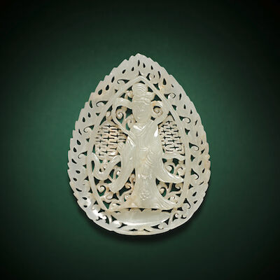 A RARE WHITE JADE OPENWORK 'FEMALE IMMORTAL' LEAF-SHAPED PENDANT Ming Dynasty