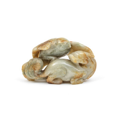 A GREEN AND RUSSET JADE 'HAWK AND MYTHICAL BEAST' GROUP Qing Dynasty