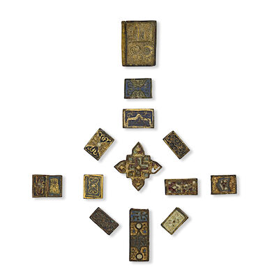 A group of thirteen Nasrid enamelled gilt-copper mounts Spain, 14th/15th Century(13)