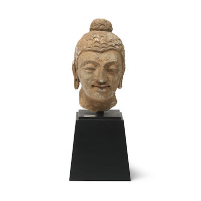 A painted stucco head of Buddha Ancient region of Gandhara, 3rd-5th Century