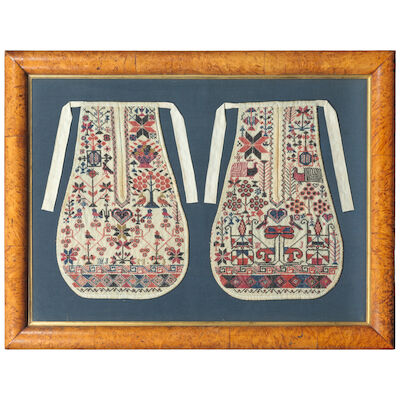 A pair of Welsh tie on sampler worked apron pockets Early 19th century