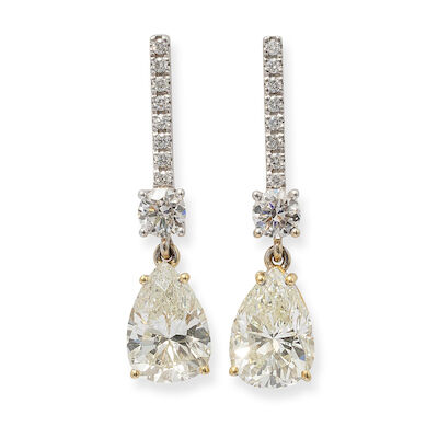 A pair of diamond ear pendants set with pear and brilliant-cut diamonds, mounted in 18k gold and white gold. (2)