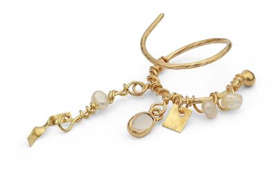 Irene Griegst: A pearl ear pendant set with pearls and a cabochon moonstone, mounted in 18k gold. L. 4.5 cm.