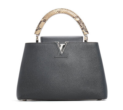Louis Vuitton: A "Capucines MM" bag of black Taurillon leather with a handle of python skin. 2024.