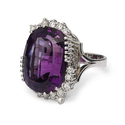 An amethyst ring set with an amethyst and numerous diamonds, mounted in 14k white gold. F-H/VVS-VS. Size 55.