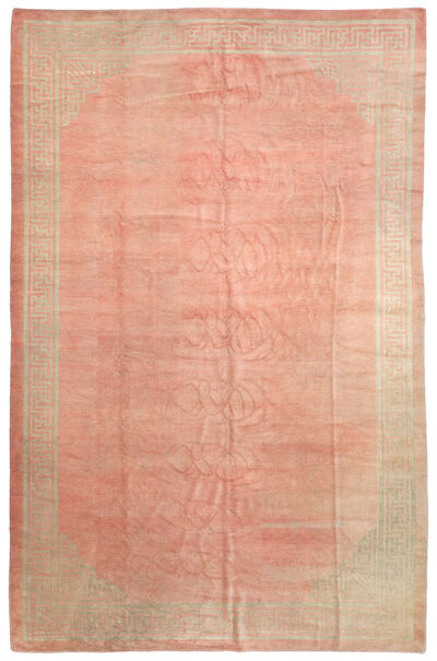 A Chinese carpet, open soft pink colored field surrounded by meander border. Mid-20th century. 468 x 306 cm.