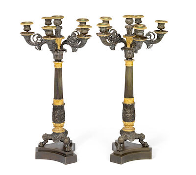 A pair of French Charles X candelabra of gilt and patinated bronze, each with five candle arms. First half of the 19th century. H. 62 cm. (2)