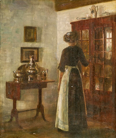 Carl Holsøe: Interior with a woman seen from behind. Signed C. Holsøe. Oil on panel. 44 x 37 cm. Interior with a woman seen from behind by newly polished silver. Signed C. Holsøe. Oil on panel. 44 x 37 cm.