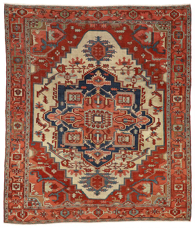 An antique Serapi carpet, North West Persia. Stylized medallion design on an ivory field of stylized foliage. C. 1890. 300 x 347 cm.