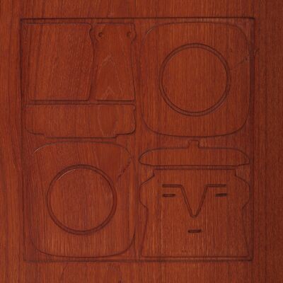Yngve Ekström: "Krus". Two-piece teak and oak cabinet with carved details depicting a face and kitchen utensils. "Krus". Two-piece teak and oak cabinet with carved details depicting a face and kitchen utensils. Lower section with two drawers and one shelf behind which two cabinet doors, upper sectio
