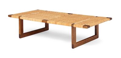Børge Mogensen: Oak bench with runner frame. Seat with woven cane. Made by cabinetmaker Erhard Rasmussen. Oak bench with runner frame. Seat with woven cane. Designed 1955. Made and marked 1950s by cabinetmaker Erhard Rasmussen. H. 33 cm. L. 138 cm. D. 68 cm.