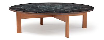 Bjørn Wiinblad: A large, circular coffee table. Top with earthenware tiles with embossed relief decor. Diam. 168 cm. A large, circular coffee table with solid pinewood frame. Top with earthenware tiles with embossed relief decor. Decorated with transparent dark gren glaze. Marked monogram Bjørn Wiin
