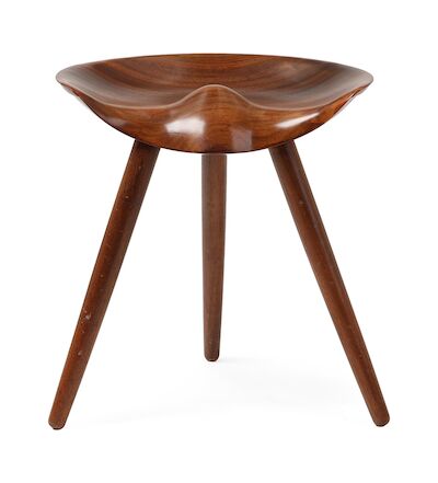 Mogens Lassen: Solid padouk stool with semi-circular seat. Mounted on three round, tapering legs. Solid padouk stool with semi-circular seat. Mounted on three round, tapering legs. Designed 1942. This example made 1950-1960s by cabinetmaker K. Thomsen.