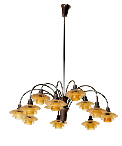 Poul Henningsen: "PH-1/1 Cascade". Browned brass 12-arm chandelier, brown bakelite socket houses with amber-coloured glass shades. "PH-1/1 Cascade". Browned brass 12-arm chandelier. Brown bakelite socket houses. Shade fittings marked "PH-1" and "Patented". Amber-coloured glass shades. Manufactured 1