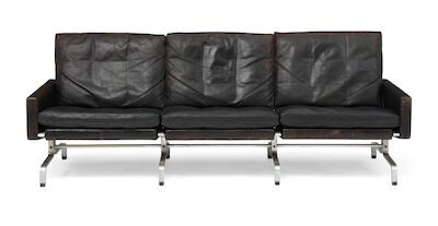 Poul Kjærholm: "PK 31/3". Freestanding three seater sofa with chromed steel frame. Upholstered with black leather. "PK 31/3". Freestanding three seater sofa with chromed steel frame. Sides, back and loose cushions upholstered with black leather. Designed 1958. This example manufactured 1960s by E. K
