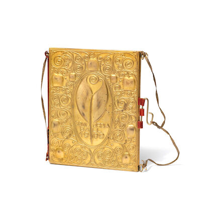 Josef Hoffmann: "Carnet de Bal". A gilded metal dance card with embossed, stylized relief decor and writing; Concordia Ball 1909. "Carnet de Bal". A gilded metal dance card with embossed, stylized relief decor and writing; Concordia Ball 1909. Red leather spine and inner part of sleeve lined with ma