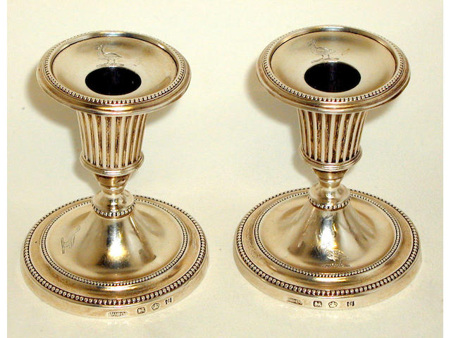 A pair of George III dwarf candlesticks,