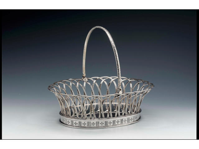 A George II oval wirework cake basket by Elizabeth Godfrey, 1756,