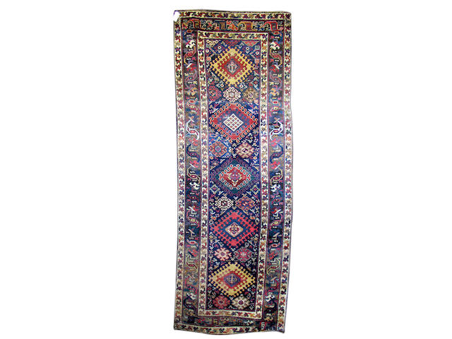 A South Caucasian runner, 305cm x 108cm,  (reduced in size)