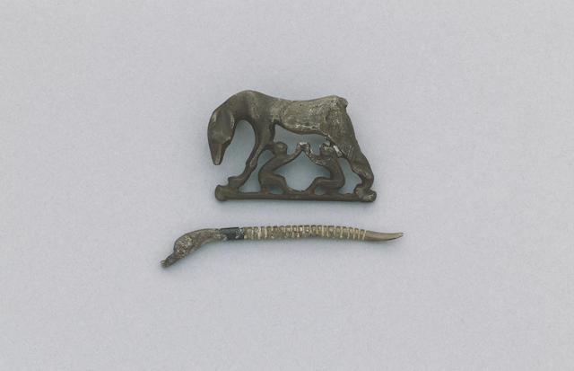 A Roman silver fibula of Romulus and Remus and a Roman pin with duck's head, circa 4th Century A.D. (2)
