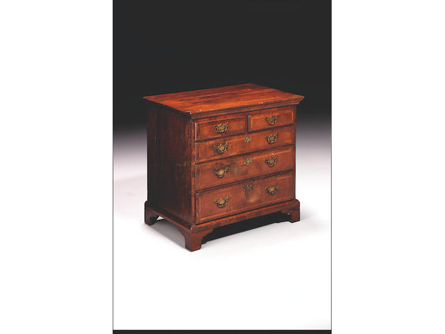 A late George II walnut veneered and featherbanded chest,