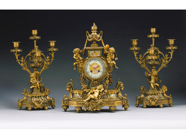 A French late 19th century gilt bronze and porcelain mounted clock garniture H.Houbebine Ft de Bronzes, Rue Turenne 64 Paris, Movement stamped Japy Freres, No. 1181 44cm