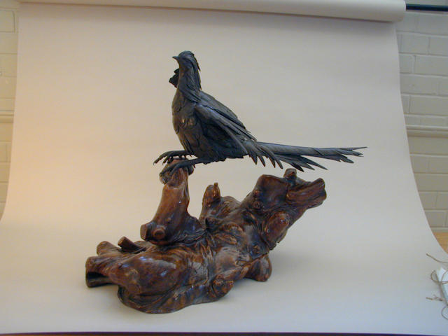A Japanese bronze model of a Golden pheasant, Meiji period, 54cm long.