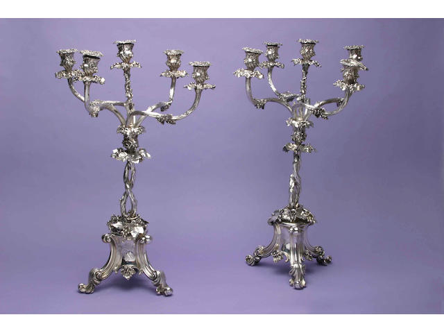 A pair of mid Victorian naturalistic four branch five light candelabra by Elkington and Co., date letter 1860,