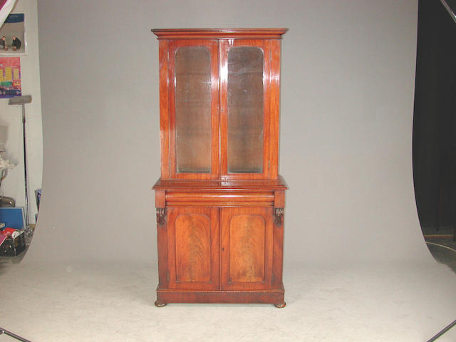 A Victorian mahogany bookcase with plain glazed doors and two cupboard doors back feet replaced 92 cms wide x 45 cms deep x 192 cms...