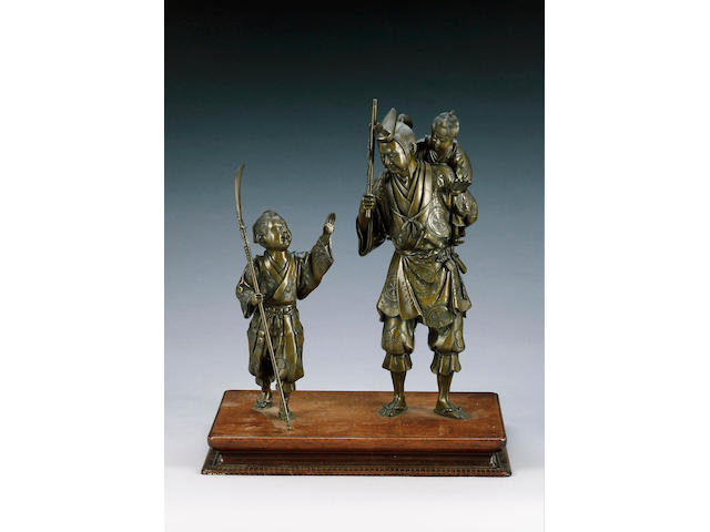 A bronze okimono group of a warrior,