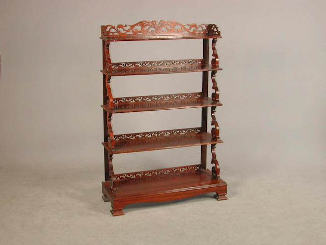 A 19th century carved rosewood waterfall bookcase