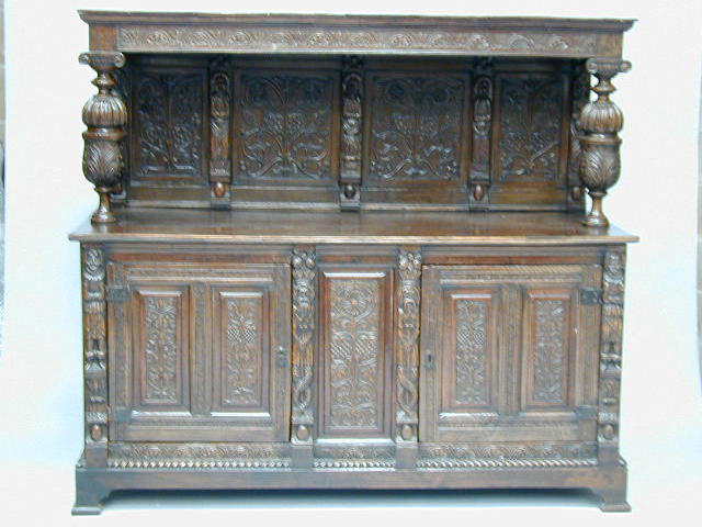 A carved oak court cupboard,