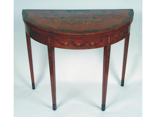 A 'Sheraton Revival' satinwood crossbanded boxwood and ebony strung painted demi lune card table,