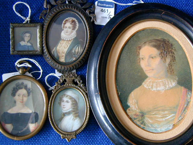 Austrian School (c.1830) A portrait of a young lady, her auburn hair in ringlets and wearing a white gown and flowered shawl Oval, together with four other decorative miniatures.
