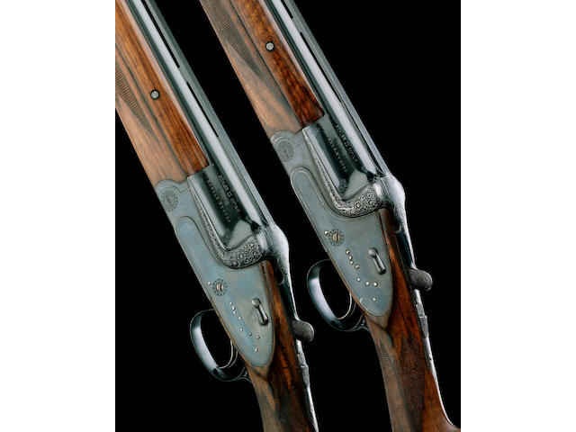 A MOST UNUSUAL PAIR OF 12-BORE (2&#190;IN) SINGLE-TRIGGER OVER-AND-UNDER SIDELOCK EJECTOR GUNS BY GEBR&#220;DER MERKEL (SUHL), NO. 15411/2 In a leather case