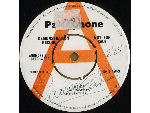 A demonstration single for The Beatles 'Love Me Do/'P.S. I Love You' autographed by Paul McCartney