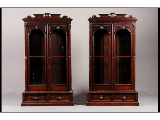 A pair of mid 19th Century walnut bookcases, <|>247cm high x 51cm deep x 134cm wide<|>