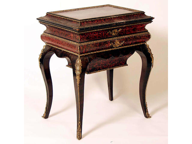 A Napoleon III mahogany, ebonized and scarlet tortoiseshell work table, 63cm wide.
