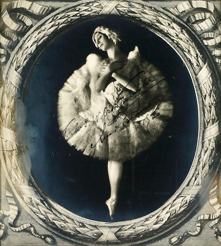 An autographed photograph of Anna Pavlova dated 1920 26 x 23 cm., framed,